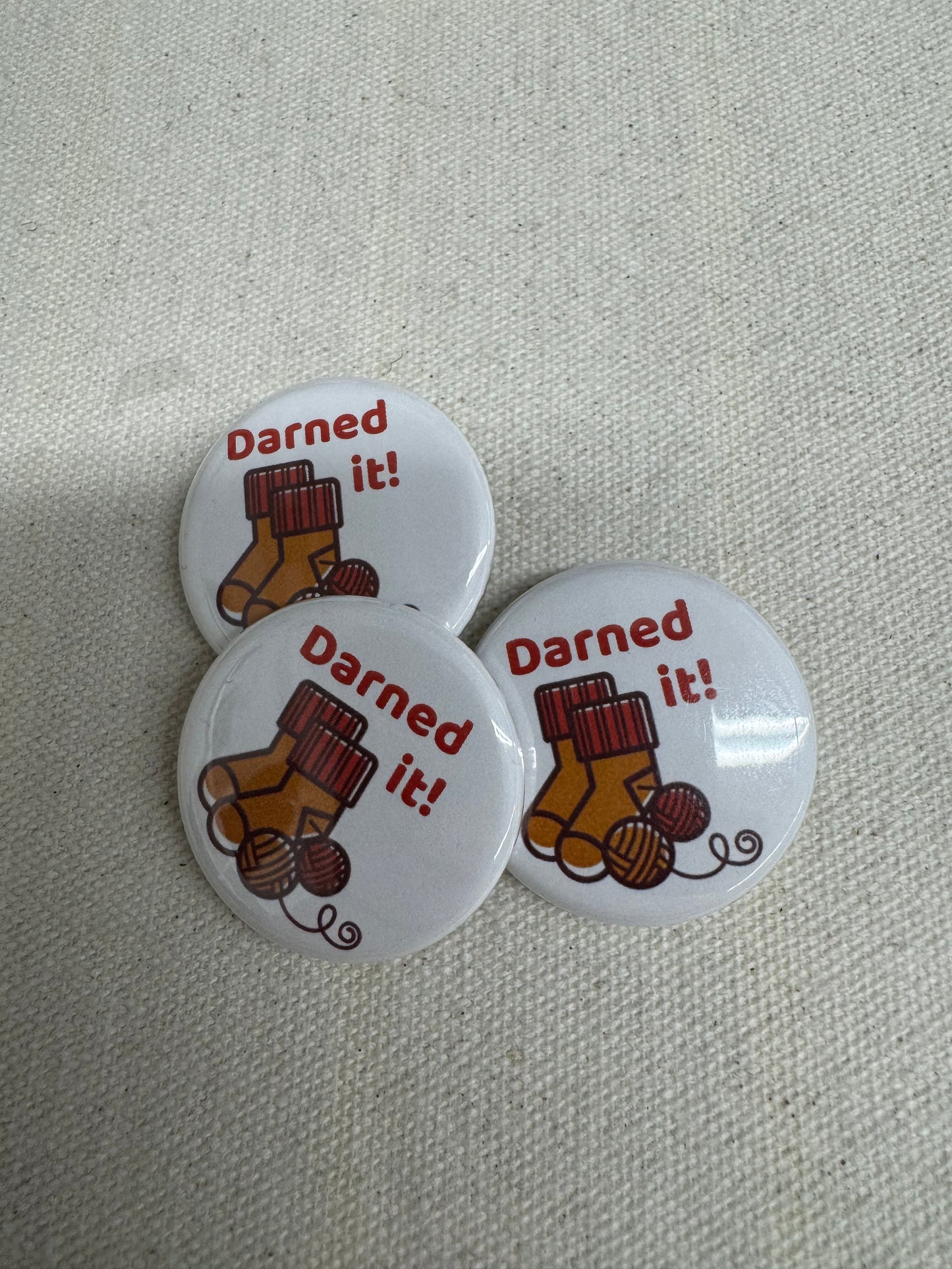 Darned it - knitted socks button